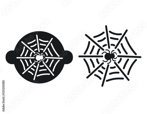Stencil for decorating confectionery for Halloween with a cobweb and a spider. Silhouette of a spider in the web