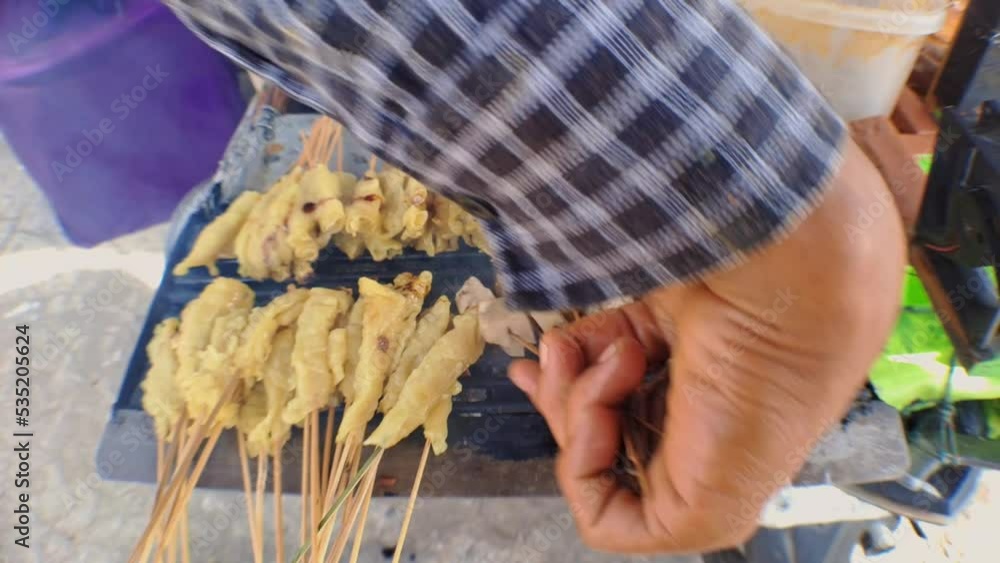Street Food satay tofu (sate tahu), Tofu grilled with soy sauce, the