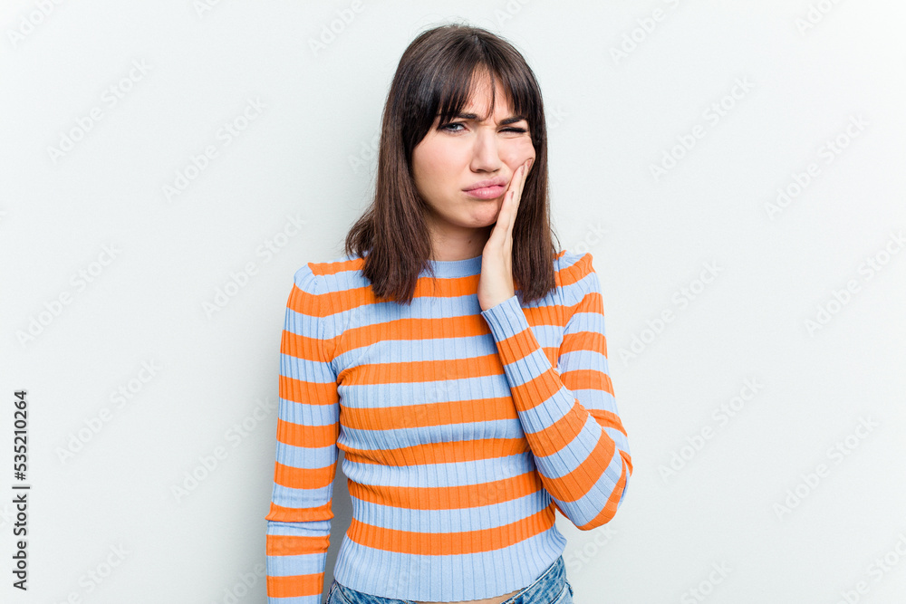 Young caucasian woman isolated on white background having a strong teeth pain, molar ache. Young caucasian woman isolated on white background having a strong teeth pain, molar ache.