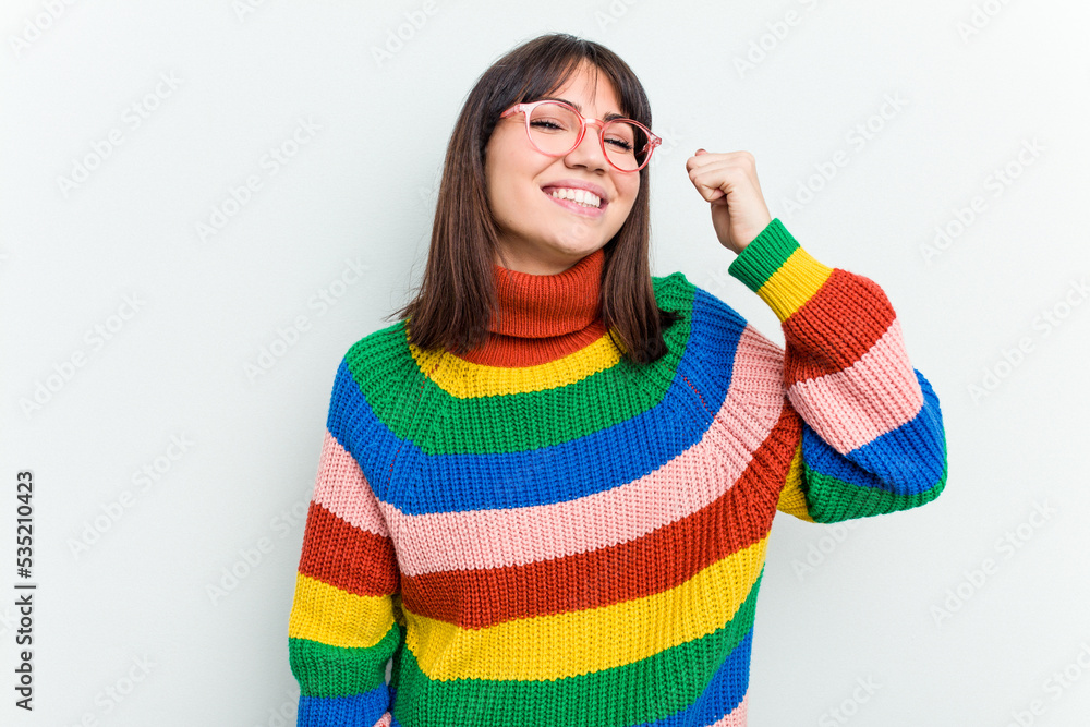 Young caucasian woman isolated on white background celebrating a victory, passion and enthusiasm, happy expression. Young caucasian woman isolated on white background celebrating a victory, passion and enthusiasm, happy expression.