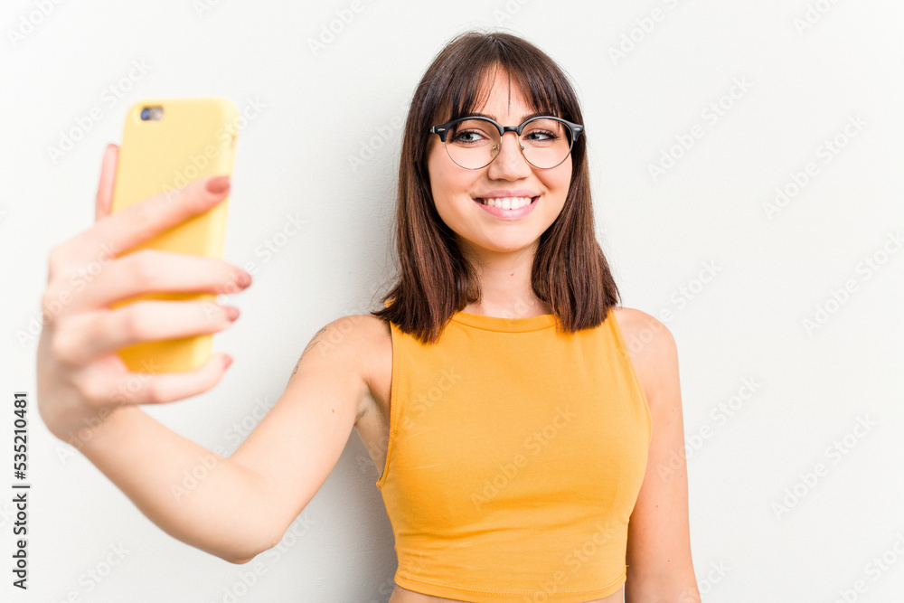 Young caucasian woman using mobile phone isolated on white background Young caucasian woman using mobile phone isolated on white background