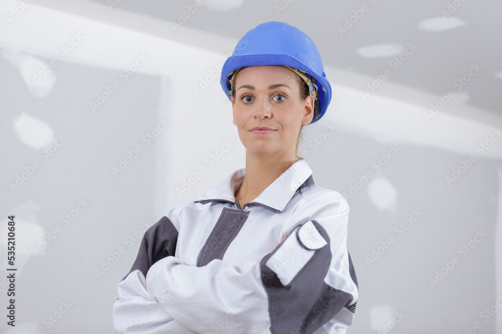 woman builder engineer standing with crossed arms woman builder engineer standing with crossed arms