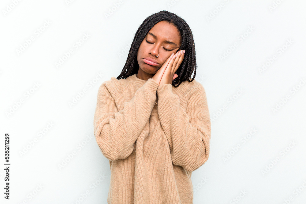 Young African American woman isolated on white background yawning showing a tired gesture covering mouth with hand. Young African American woman isolated on white background yawning showing a tired gesture covering mouth with hand.