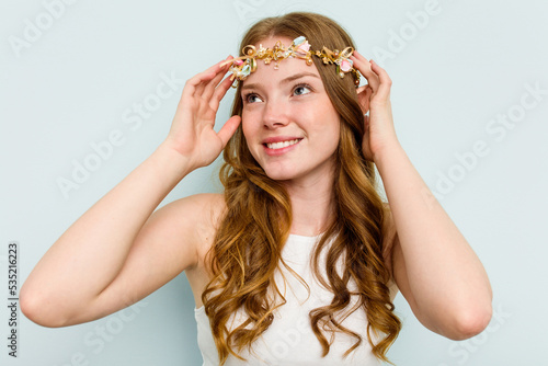 Young elf woman isolated on blue background