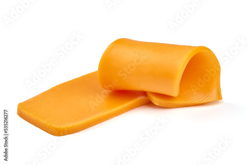 Piece of Cheddar cheese, isolated on white background. High resolution image.