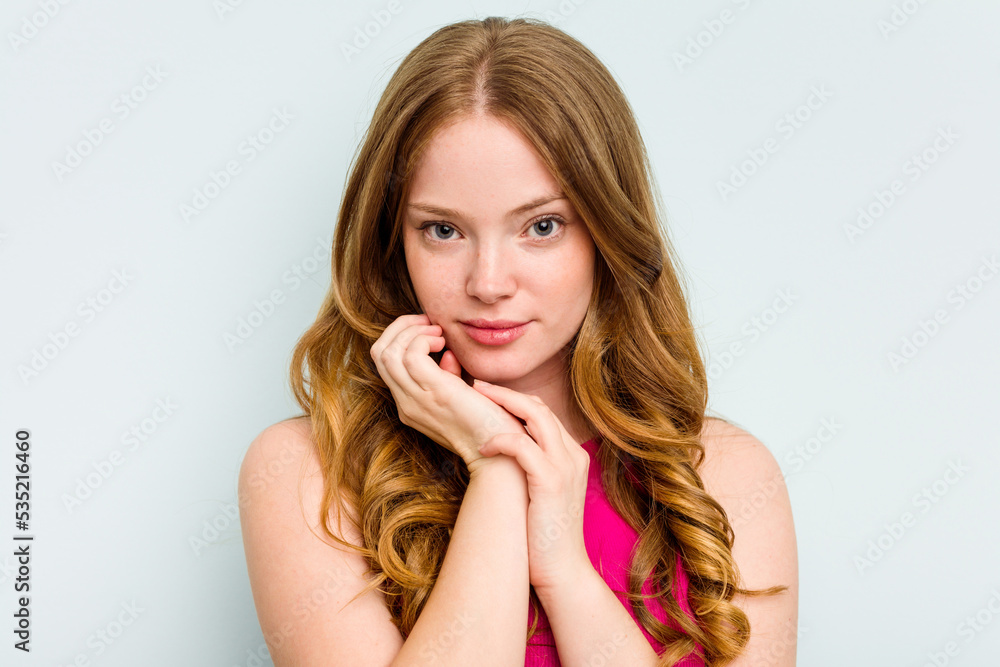 Portrait of pretty young caucasian woman isolated on blue background Portrait of pretty young caucasian woman isolated on blue background