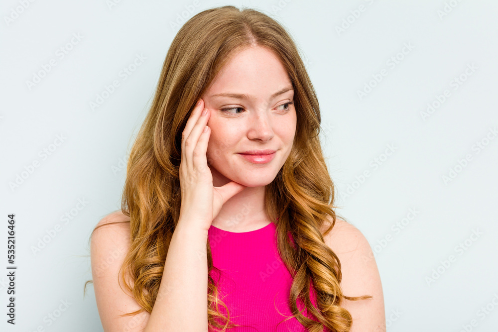Portrait of pretty young caucasian woman isolated on blue background Portrait of pretty young caucasian woman isolated on blue background