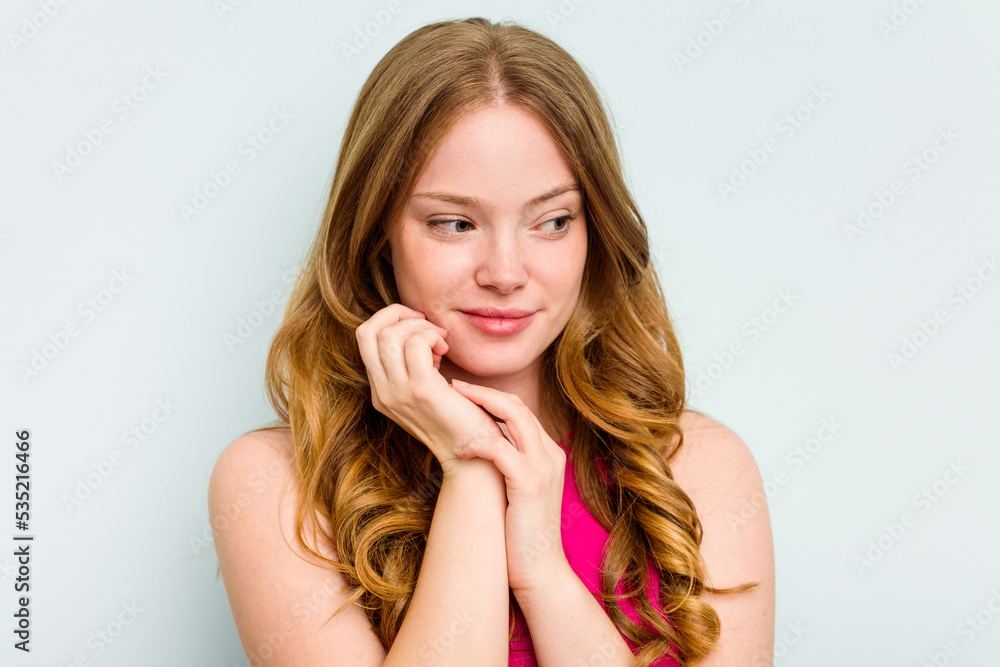 Portrait of pretty young caucasian woman isolated on blue background Portrait of pretty young caucasian woman isolated on blue background