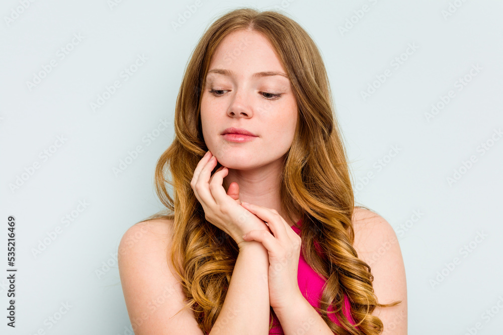 Portrait of pretty young caucasian woman isolated on blue background Portrait of pretty young caucasian woman isolated on blue background