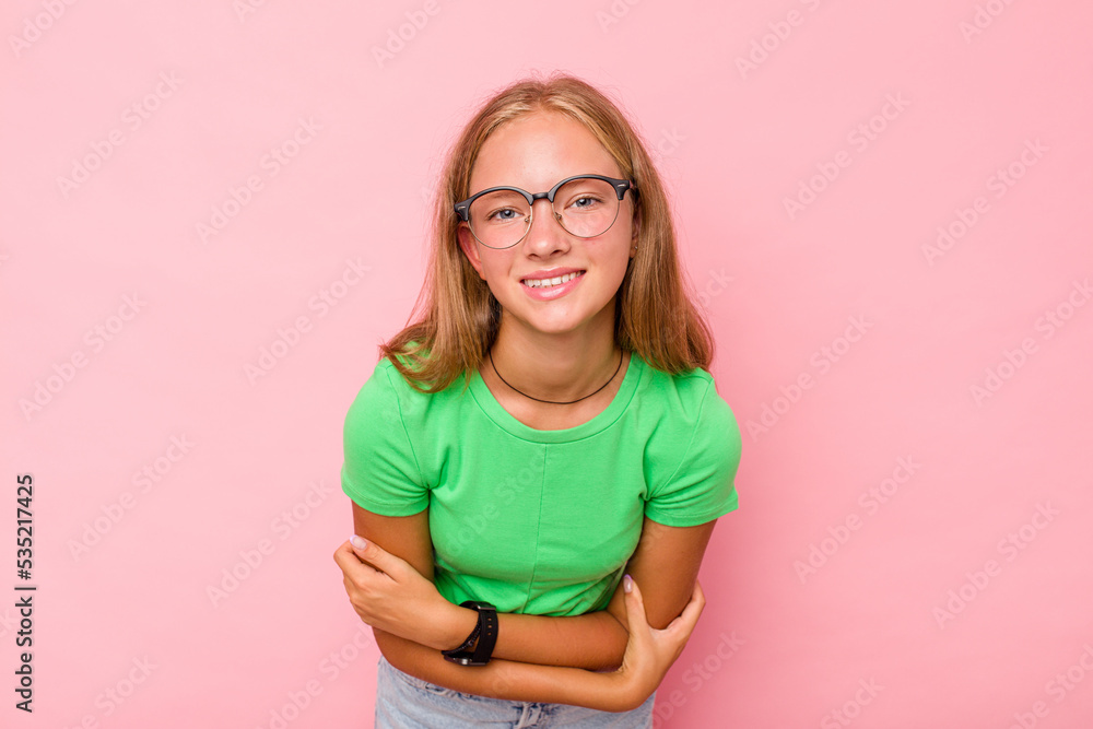 Caucasian teen girl isolated on pink background laughing and having fun. Caucasian teen girl isolated on pink background laughing and having fun.