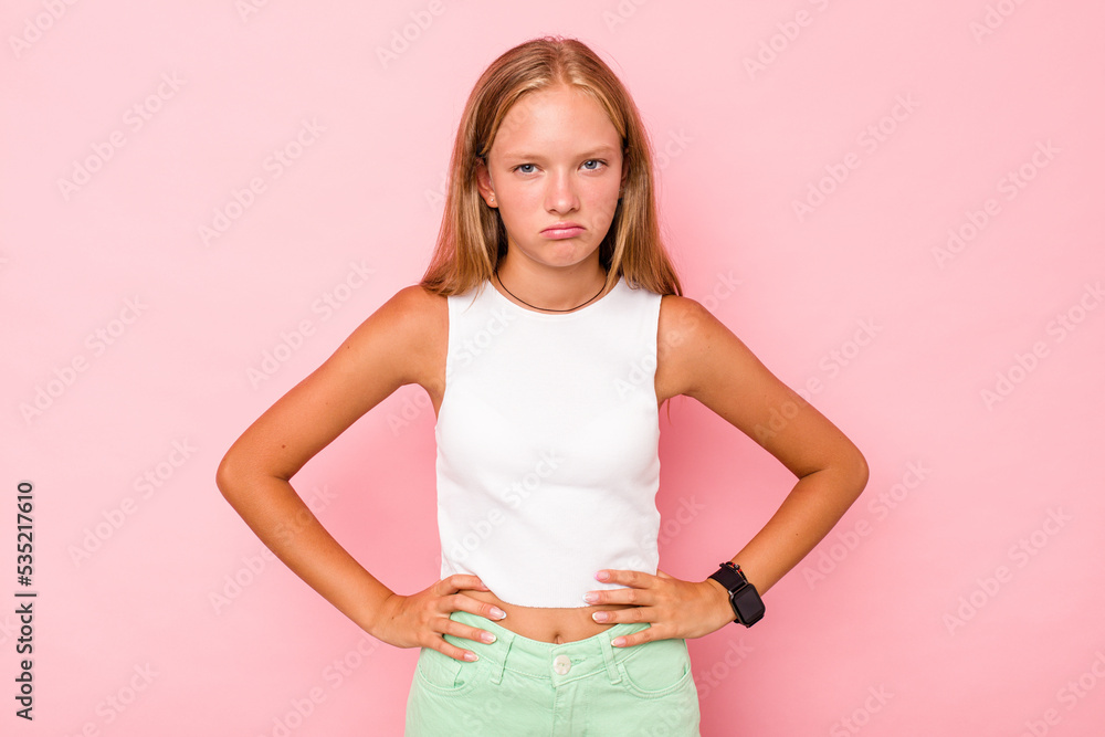 Caucasian teen girl isolated on pink background sad, serious face, feeling miserable and displeased. Caucasian teen girl isolated on pink background sad, serious face, feeling miserable and displeased.