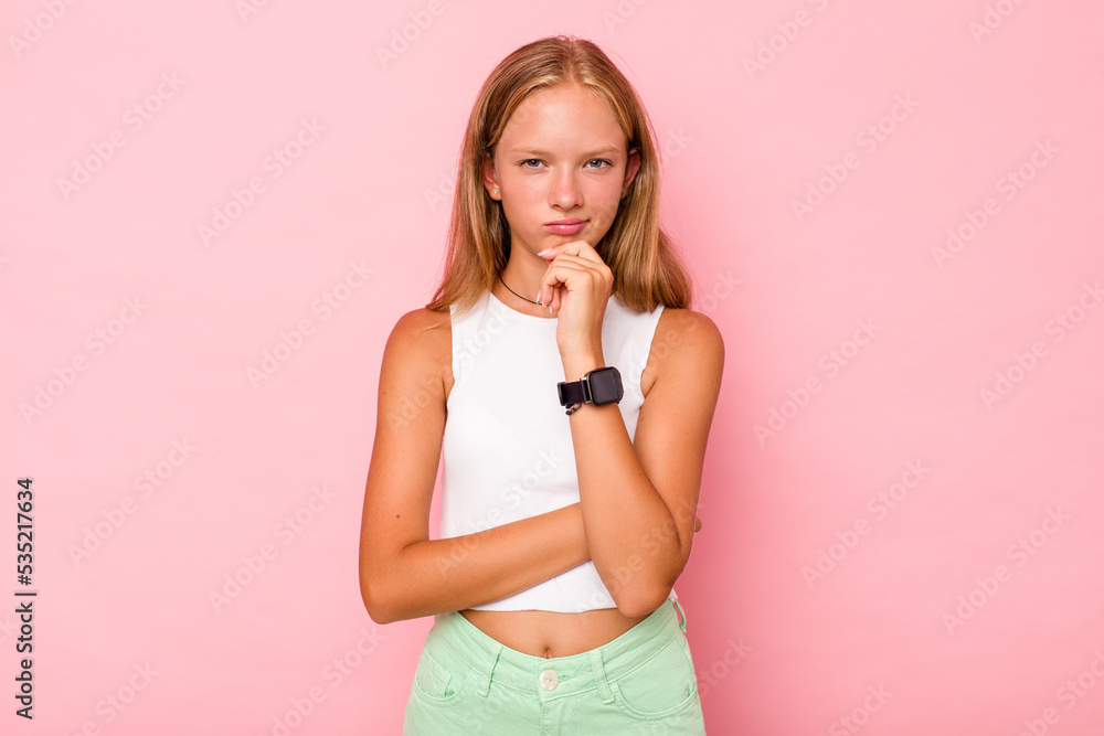 Caucasian teen girl isolated on pink background thinking and looking up, being reflective, contemplating, having a fantasy. Caucasian teen girl isolated on pink background thinking and looking up, being reflective, contemplating, having a fantasy.