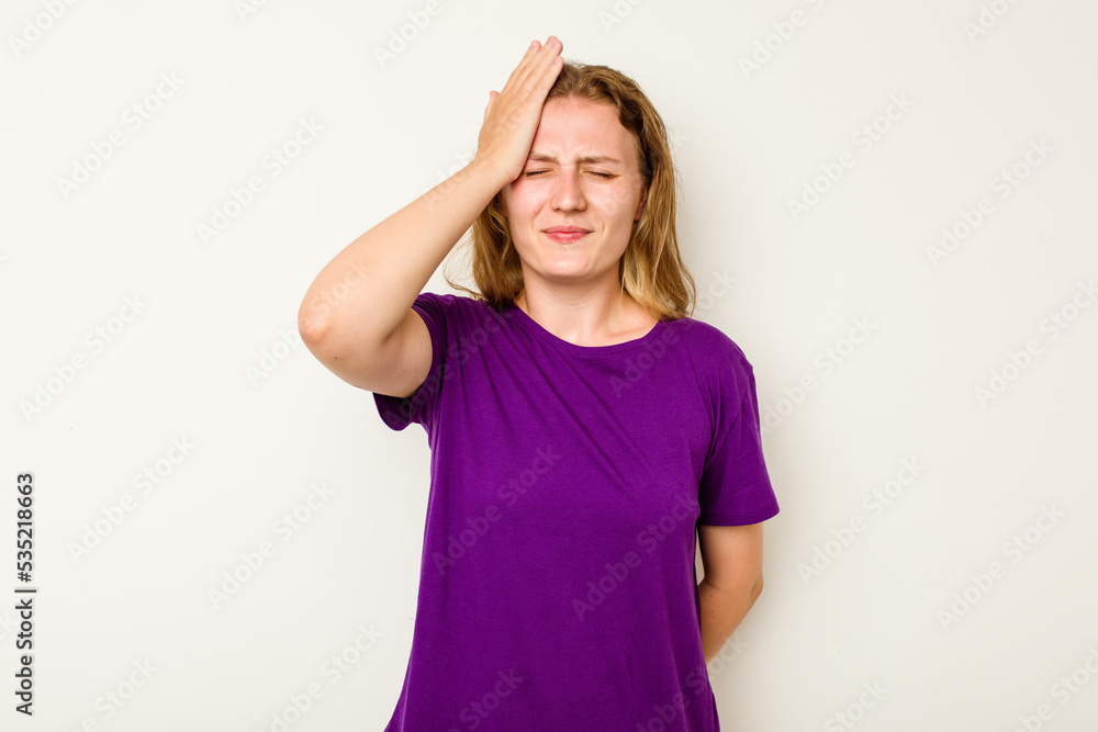 Fototapeta premium Young caucasian woman isolated on white background forgetting something, slapping forehead with palm and closing eyes.