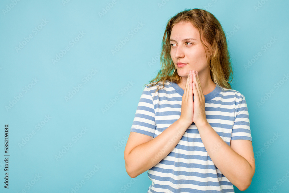 Young caucasian woman isolated on blue background making up plan in mind, setting up an idea. Young caucasian woman isolated on blue background making up plan in mind, setting up an idea.