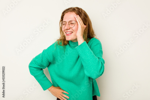 Young caucasian woman isolated on white background joyful laughing a lot. Happiness concept. © Asier