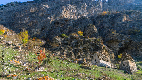 The city of the dead in North Ossetia. An ancient necropolis high in the mountains. A complex of ground and semi-underground structures-crypts. Ancient stone buildings in an ancient city. Ancient city