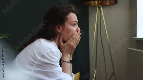 Sad unhappy young brunette woman having psychological problem, feeling anxiety depression, thinking of personal or health troubles lonely at home.Suffering from depression, worry about wrong decision