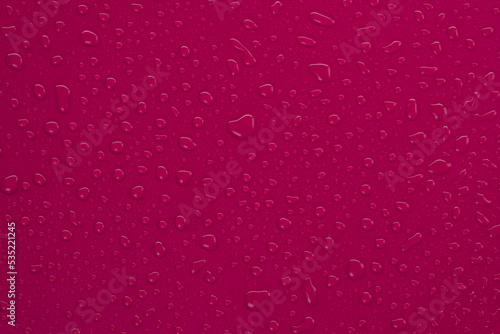 burgundy or magenta background with drops closeup
