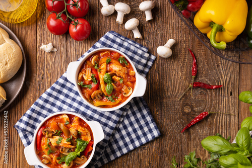 Chicken stew with peppers  mushrooms and tomatoes.