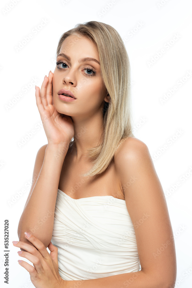 portrait of blonde woman with blue eyes and bare shoulders looking at camera isolated on white. portrait of blonde woman with blue eyes and bare shoulders looking at camera isolated on white.