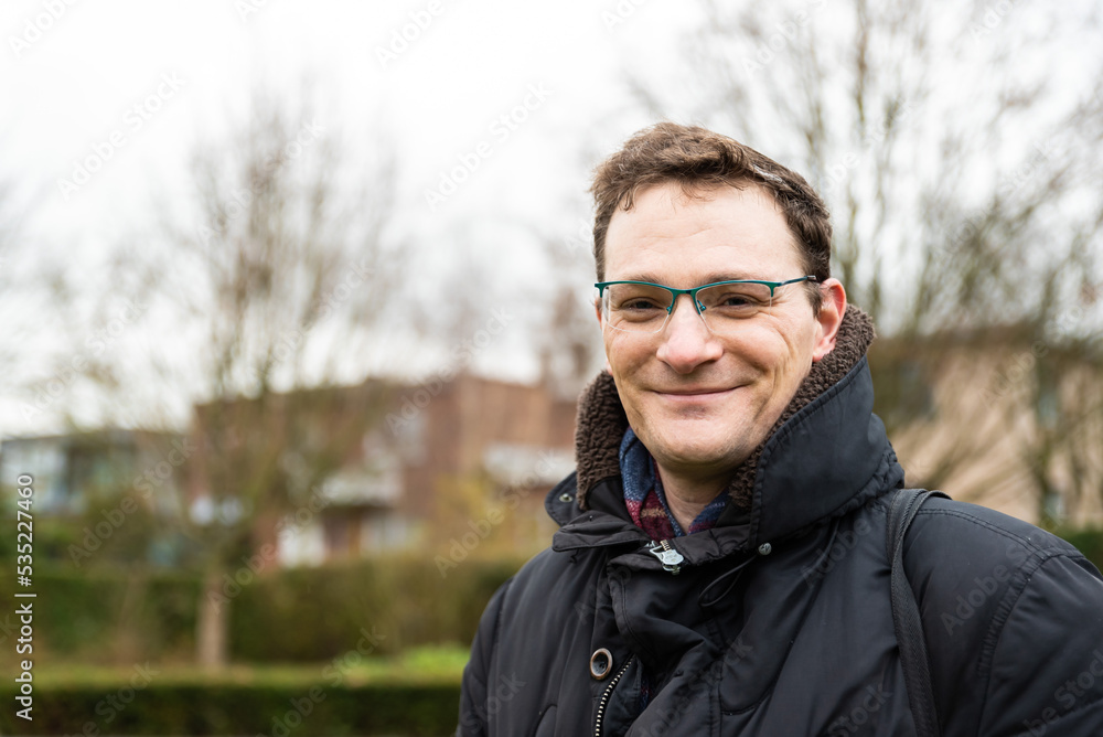 Portrait of a 40 yo white man in winter clothes with anature background Portrait of a 40 yo white man in winter clothes with anature background