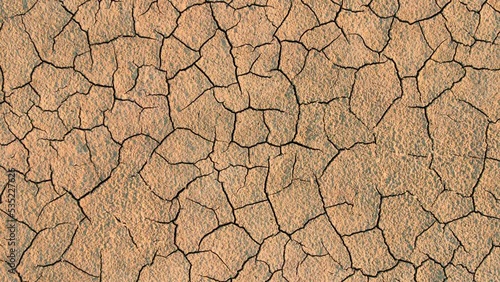 Cracked earth from drought. Global warming, cataclysm. Climate change and dry weather. Economic crisis, food crisis. Poor harvest due to dry weather. Soil erosion. The dried-up mouth of the river.