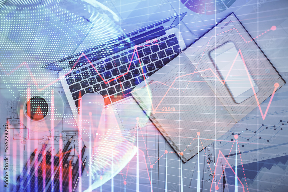 Obraz premium Multi exposure of forex chart drawing over table background with computer. Concept of financial research and analysis. Top view.