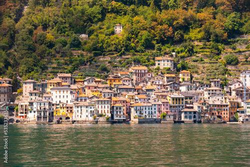 Beautiful panorama of lake Como with a small coastal town, famous tourism destination photo