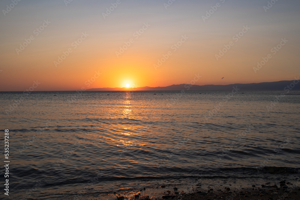 sea, beach and cloudy sky at sunset. Ayvalk Turkey sea, beach and cloudy sky at sunset. Ayvalk Turkey