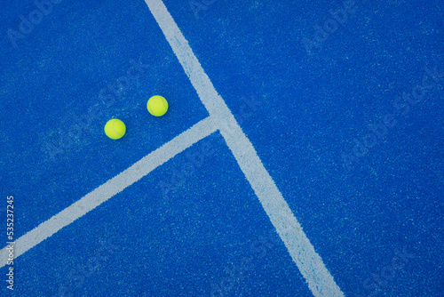 Paddle tennis balls on a paddle tennis court for background © Vic