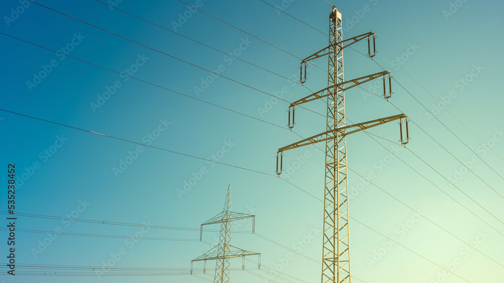 High voltage electrical power towers or pylons and wire lines in