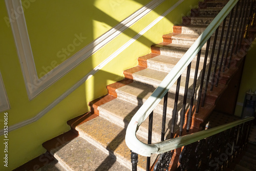 Photo of staircase in residential house. Typical building in historical center in Saint Petersburg  Russia. Steps with forged fence. apartment house.