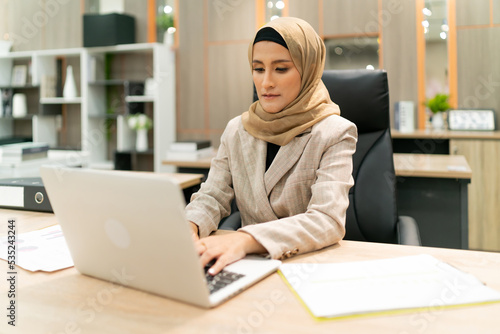 beautiful business Muslim hijab woman work. serious female islam person think about plan while working at workplace. occupation focus arabic worker thinking and find motivation for working in office
