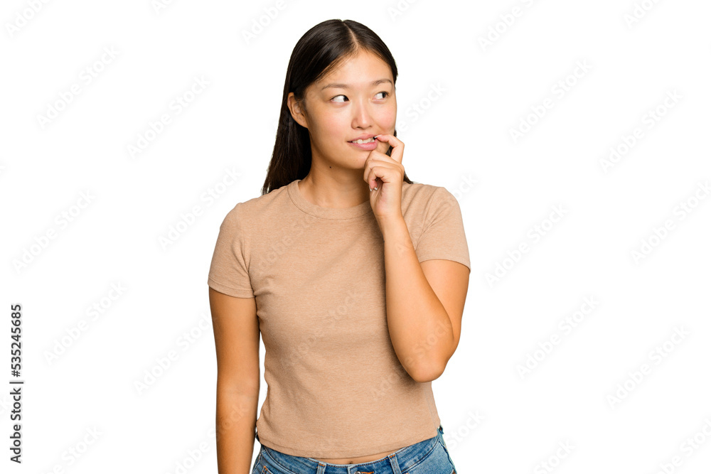Young Asian woman isolated on green chroma background relaxed thinking about something looking at a copy space. Young Asian woman isolated on green chroma background relaxed thinking about something looking at a copy space.