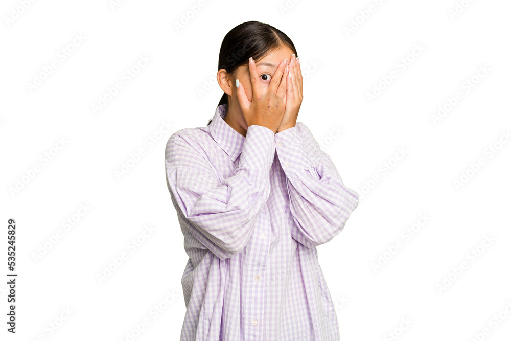 Young Asian woman isolated on green chroma background blink through fingers frightened and nervous. Young Asian woman isolated on green chroma background blink through fingers frightened and nervous.
