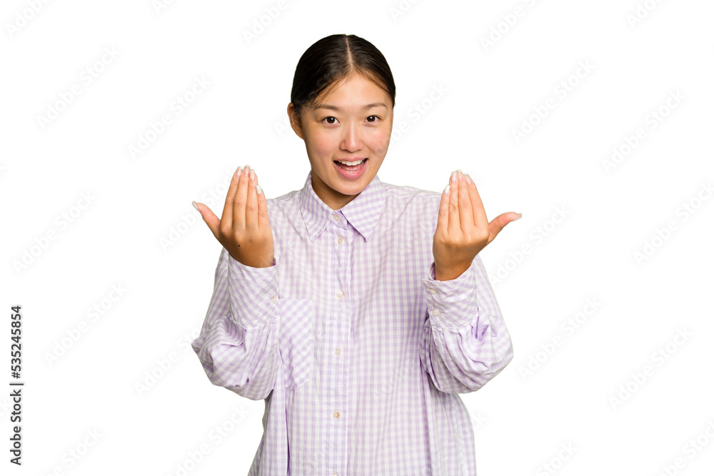 Young Asian woman isolated on green chroma background pointing with finger at you as if inviting come closer. Young Asian woman isolated on green chroma background pointing with finger at you as if inviting come closer.
