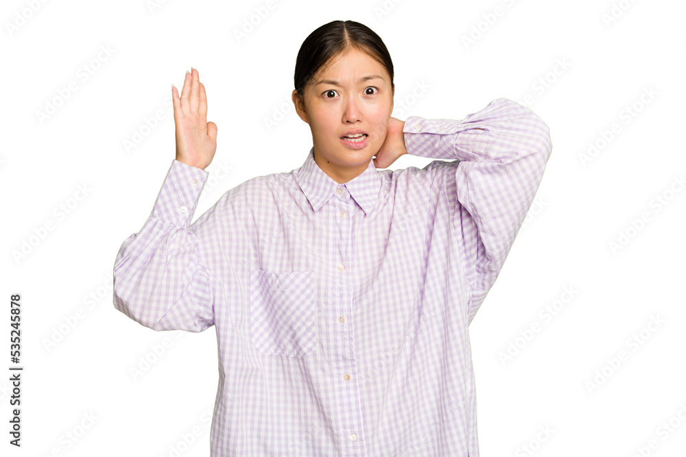 Young Asian woman isolated on green chroma background screaming with rage. Young Asian woman isolated on green chroma background screaming with rage.