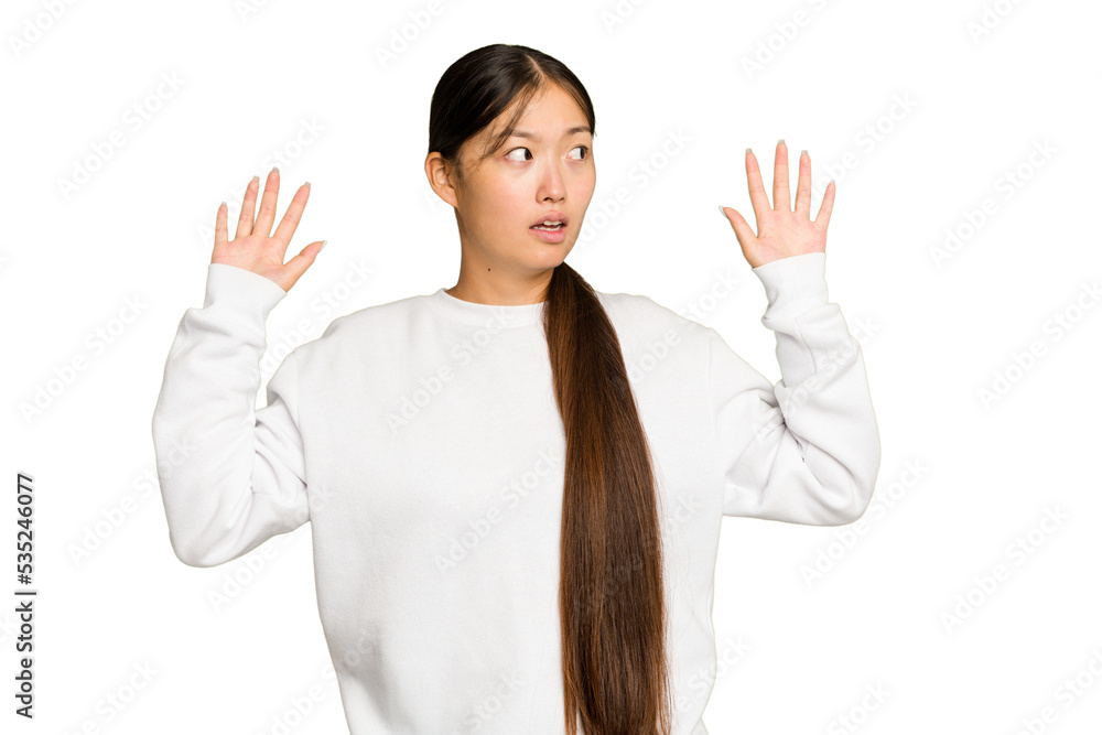 Young Asian woman isolated on green chroma background being shocked due to an imminent danger Young Asian woman isolated on green chroma background being shocked due to an imminent danger
