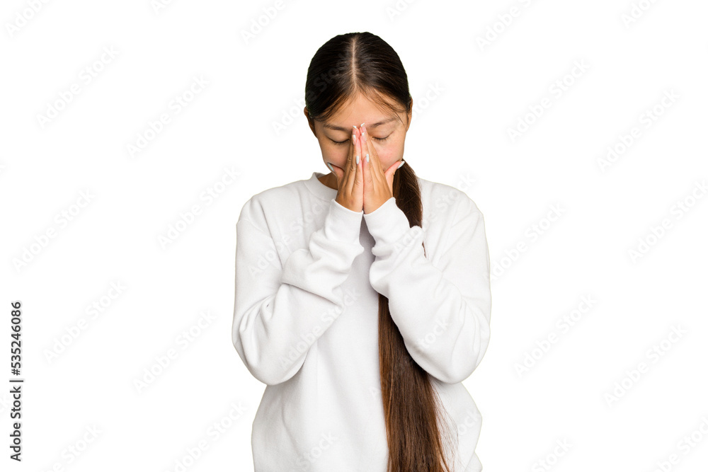 Young Asian woman isolated on green chroma background praying, showing devotion, religious person looking for divine inspiration. Young Asian woman isolated on green chroma background praying, showing devotion, religious person looking for divine inspiration.