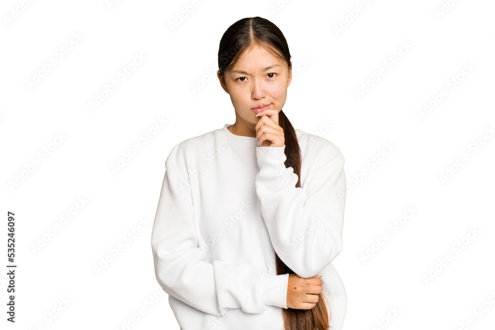 Young Asian woman isolated on green chroma background thinking and looking up, being reflective, contemplating, having a fantasy. Young Asian woman isolated on green chroma background thinking and looking up, being reflective, contemplating, having a fantasy.