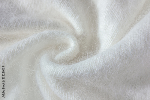 Swirl of White alpaca Fabric and mohair wool sweater texture. photo