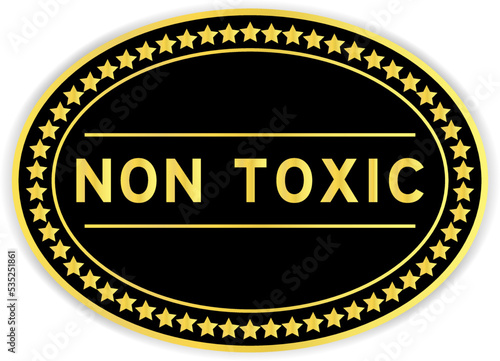 Black and gold color oval label sticker with word non toxic on white background