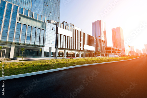 Empty asphalt road and modern buildings