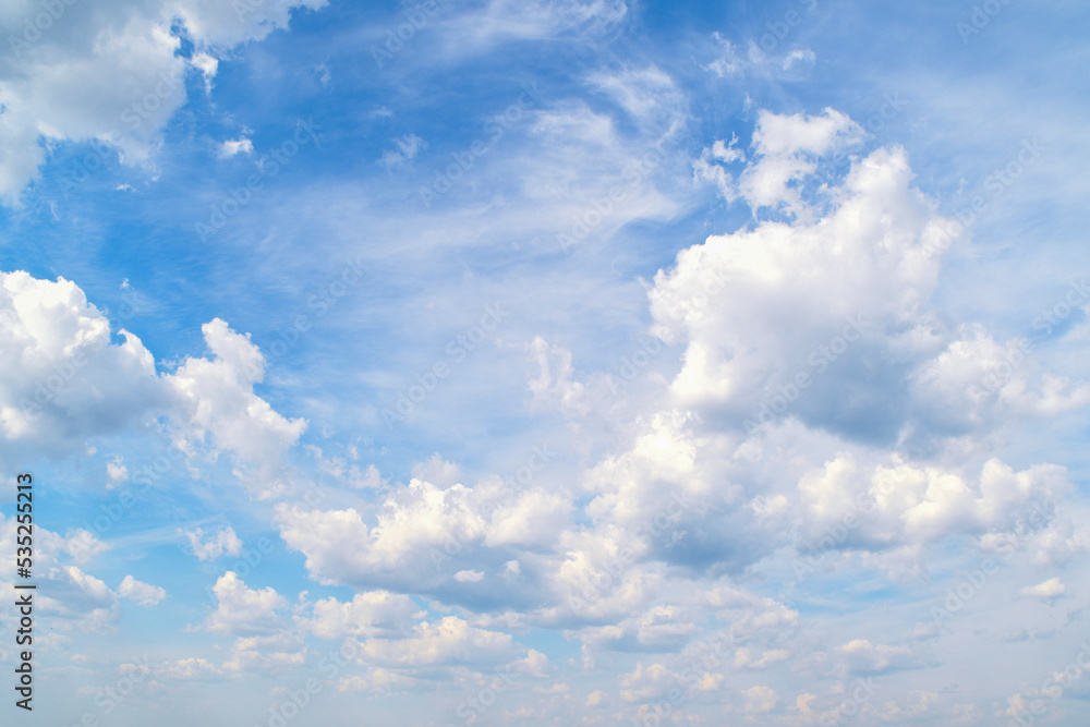 Obraz premium Background with high blue sky and white clouds. Summer sky with cumulus clouds.
