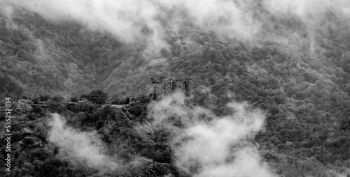 Ussel Castle shrouded in fog Aosta Valley Italy photo
