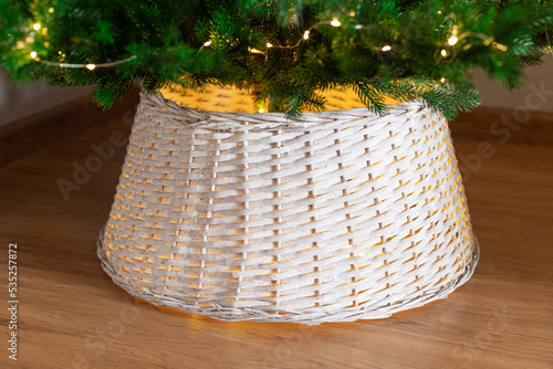 white wicker basket for Christmas tree. Christmas tree base cover. closeup