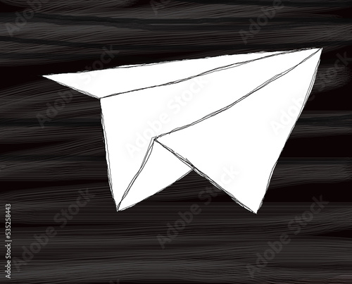 Hand drawn paper airplaine on an irregular black and grey background photo