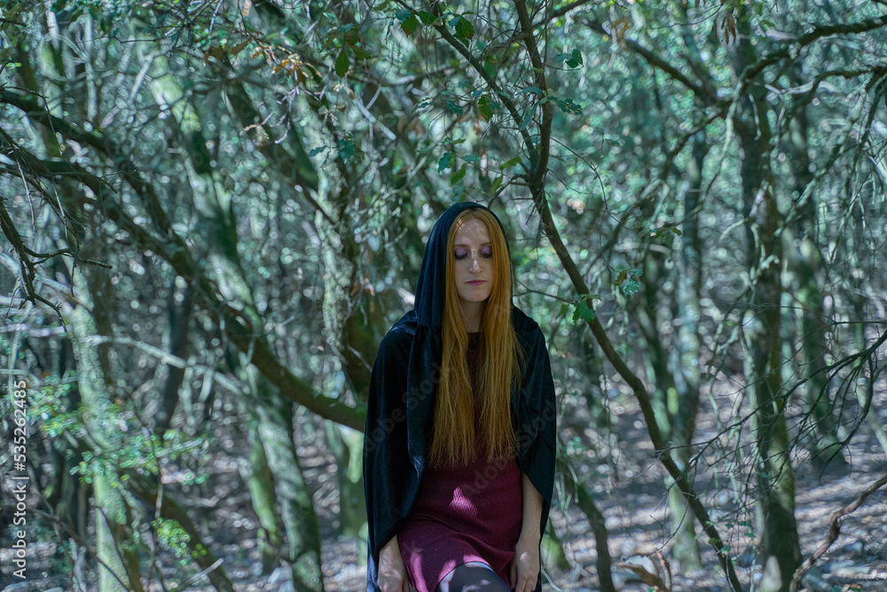 Two young witches searching for objects in the woods Two young witches searching for objects in the woods