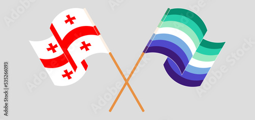 Crossed and waving flags of Georgia and gay men pride