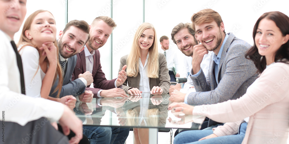 successful business team sitting at the table in the conference successful business team sitting at the table in the conference